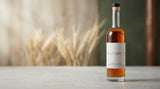 Patty Green Lightning Barley Whiskey bottle in a softly lit barley setting