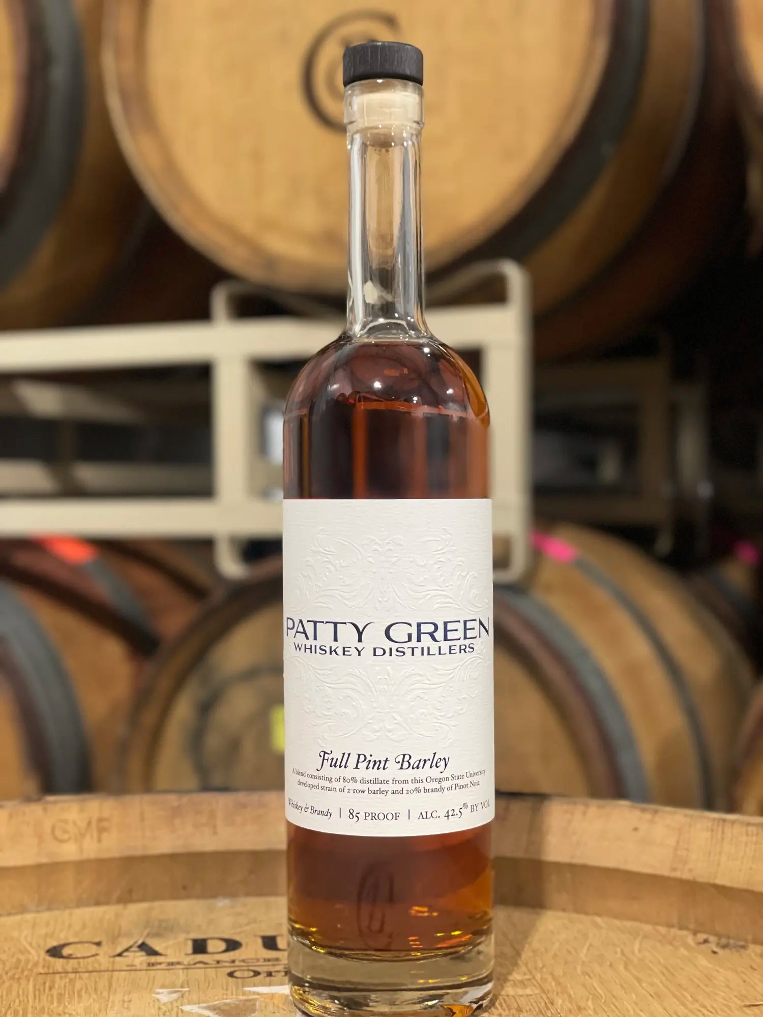 Full Pint Barley whiskey resting on an oak barrel at Patricia Green Cellars