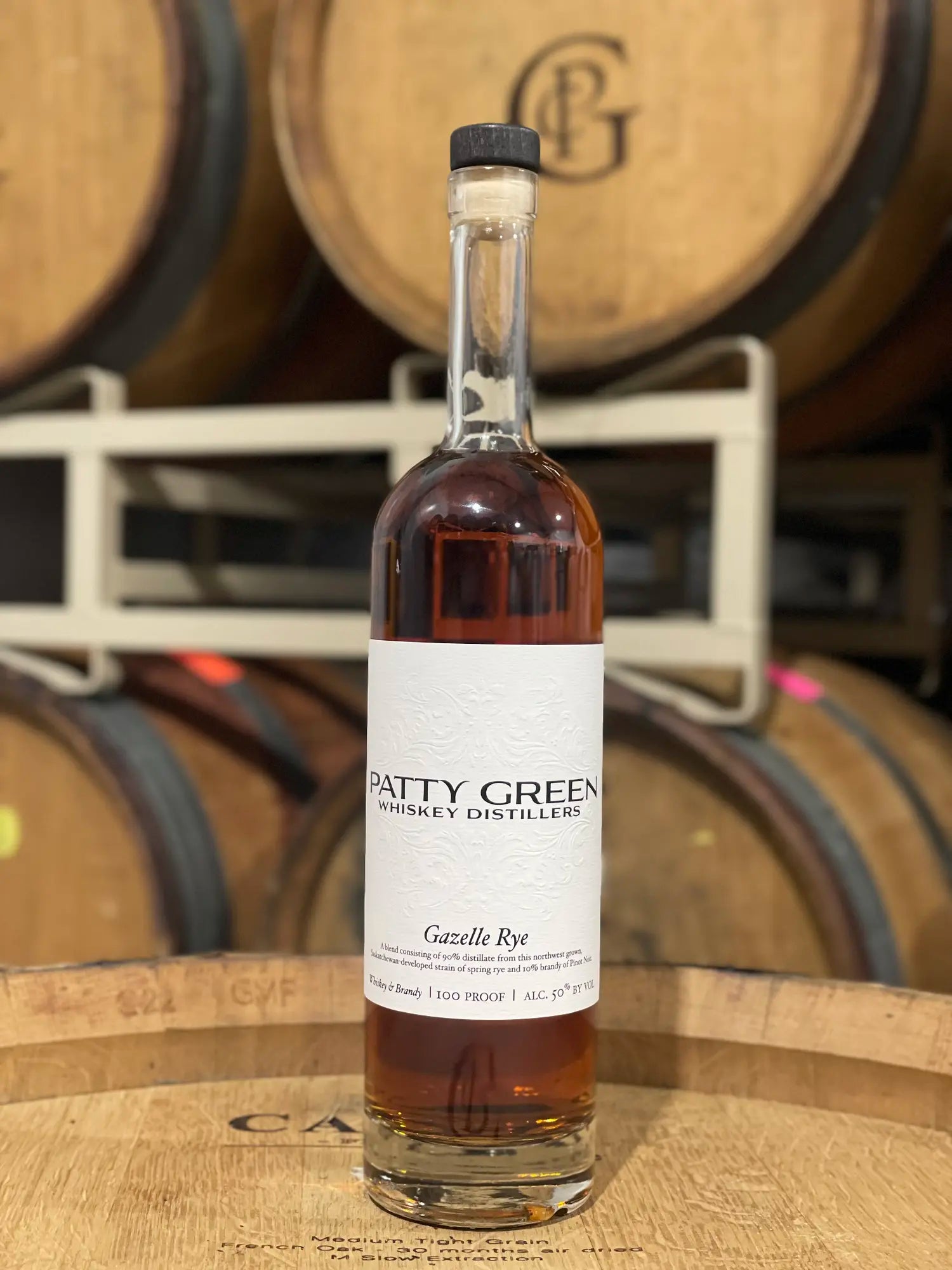 Gazelle Rye whiskey resting on an oak barrel at Patricia Green Cellars