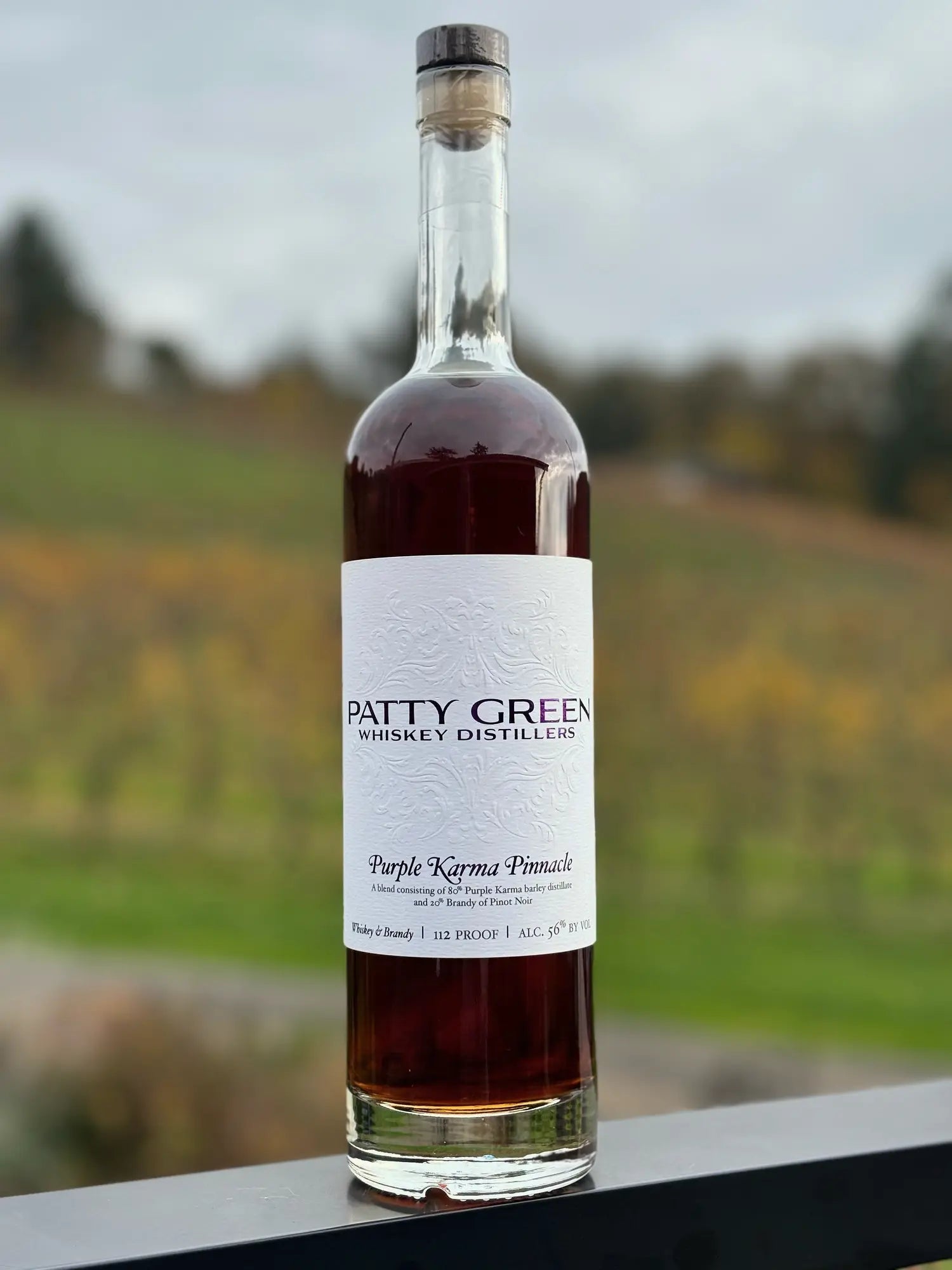 Purple Karma Pinnacle whiskey overlooking the Patricia Green Cellars estate