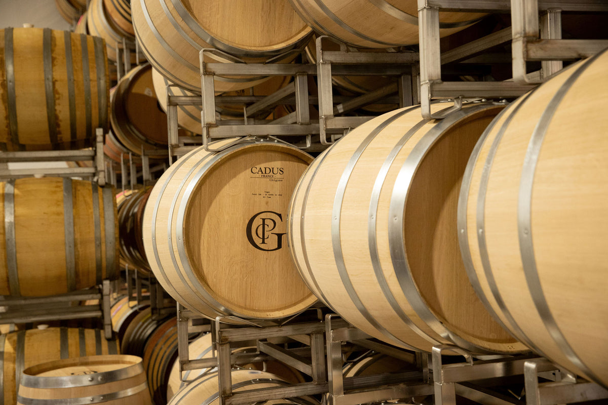 French oak barrels stacked in the Patricia Green Cellars cellar