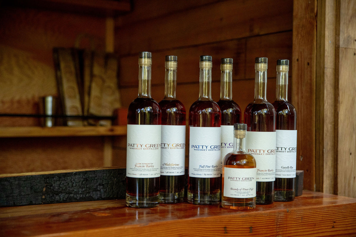 Patty Green brandy bottles arranged in the estate tasting hut